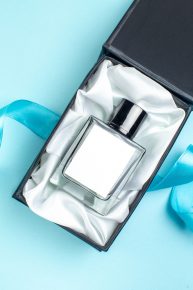 top-view-valentines-day-present-fragnance-inside-package-blue-surface-color-marriage-couple-gift-perfume-feeling-woman